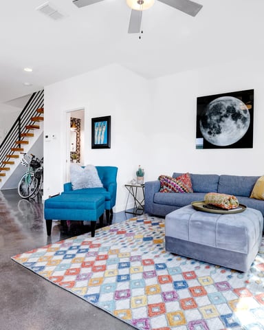 Urban townhouse open living room with floating staircase