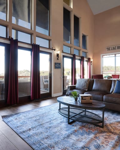 Lake House open-plan living room with tall ceilings and large windows