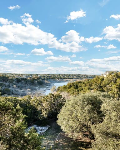 Canyon Lake shoreline with limestone cliffs and clear blue water