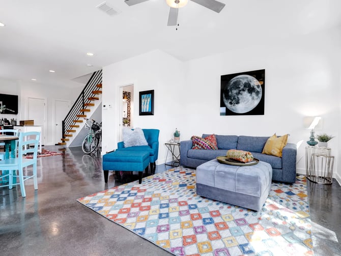Urban townhouse open living room with floating staircase