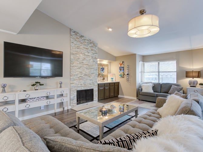 Tower Point condo living room with stone fireplace